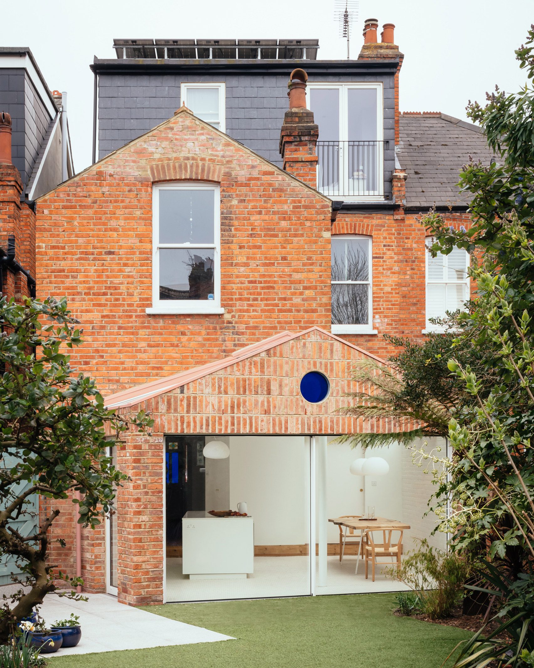 Modern brick home extension with large windows